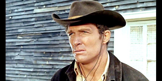 Brad Harris as Sheriff Bill Manners, a lawman who smells trouble in Rattler Kid (1968)