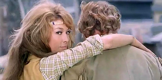 Claudia Gravy as Mary, embracing one man and teasing another in Matalo (1970)