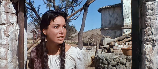 Elisa Montes as Petra, frightened as bandits descend on the village where she and Chico live in Return of the Seven (1966)