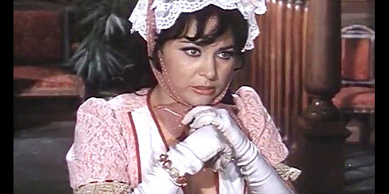 Gabriella Giorgelli as Juanita, posing as someone she's not in The Beast (1970)