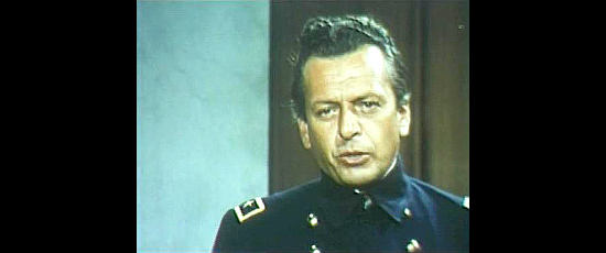 Gerard Tichy as Frank Hamilton, prosecuting the case against Roy Dexter in Four Dollars for Revenge (1966)