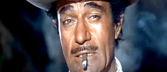Gilbert Roland as Montero, the bandit who steals, then loses $300,000 in Any Gun Can Play (1967) 