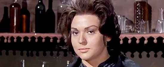 Gina Rovere as Bess, wondering about the brazen newcomer to Snake Valley in Sugar Colt (1966)