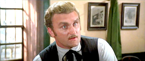 Joe Bugner as Sheriff Bronson, warns of the dangers in Yucca City in Buddy Goes West (1981)