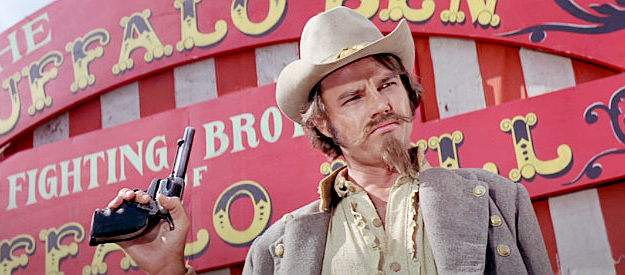 Joe Dan Baker as Slater, a one-armed gunman who joins Chris's seven in Guns of the Magnificent Seven (1969)