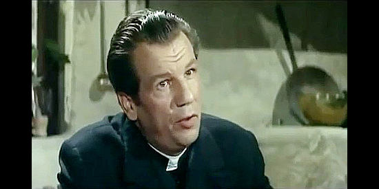 John Bartha as Father Ryan, the priest who watches over Johnny's daughter in Man from the Cursed Valley (1964)