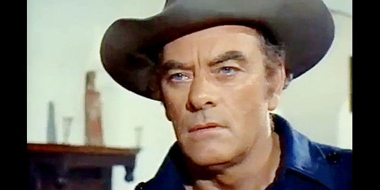 John Ireland as Jones, a drifter trying to put the violence in his past behind him in Challenge of the McKennas (1970)