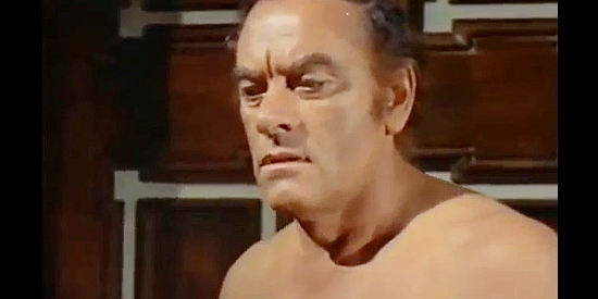 John Ireland as Jones, haunted by the violence in his past in Challenge of the McKennas (1970)
