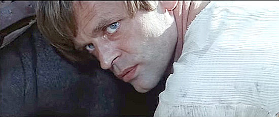 Klaus Kinski as Blonde, watching for the perfect time for a double cross in The Ruthless Four (1967)