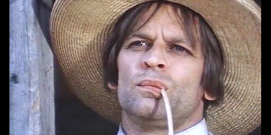 Klaus Kinski as Crazy Johnny waiting for his next potential victim to arrive in The Beast (1970)