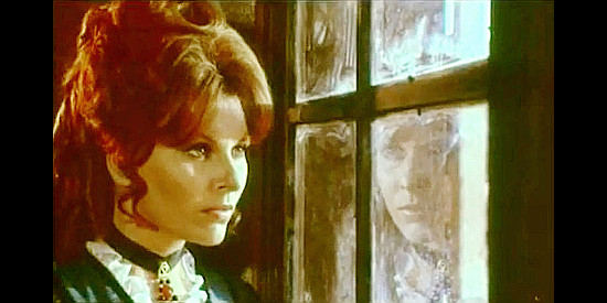 Loredana Nusciak as Ann Bower watches her husband henchmen close in on her and Chaliko in Vengeance for Vengeance (1968)