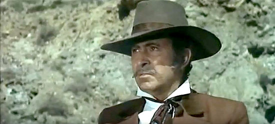 Luis Prendes as John Tunstill senses an ambush in A Few Bullets More (1967)