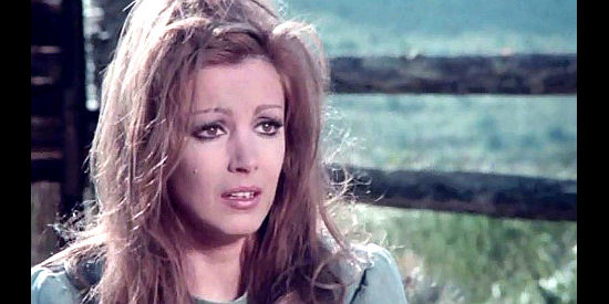 Maria Pia Conte as Susan, mourning her father after he was shot down by Corrales' men in And the Crows Will Dig Your Grave (1972)