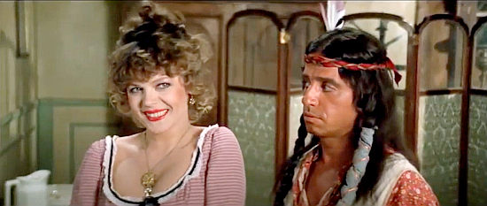 Marlida Dona as Mrs. Robinson, flirting with Buddy while Amidou as Cocoa looks on in Buddy Goes West (1981)