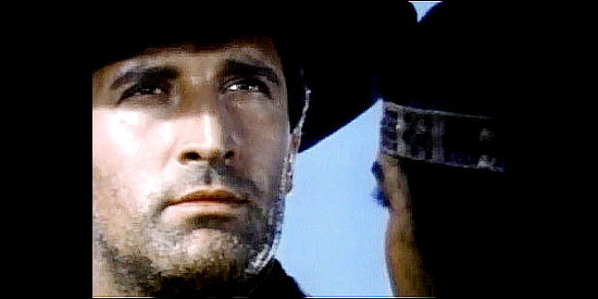 Mimmo Palmara (Dick Palmer) as Johnny West, pondering whether he can afford to love again in Johnny West (1965)