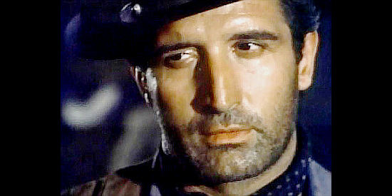 Mimmo Palmara (Dick Palmer) as Johnny West, ready to blind a member of the Jefferson gang to make him talk in Johnny West (1965)