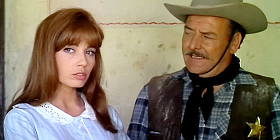 Nuria Torray as Mary Patterson with the sheriff (Arthur Gonzalez). discussing JImmy's trouble with the law in Ballad a Bounty Hunter (1966)