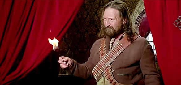Osiride Pevarello as Jose, using a fire-breathing trick in an attempt to get information from Moira in Chapaqua's Gold (1970)