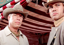 George Kennedy as Chris Adams and Jon Don Baker as Slater in Guns of the Magnificent Seven (1969)
