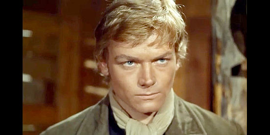 Peter Lee Lawrence as Bill Grayson, a man out to clear his father's name in One by One Without Pity (1968)