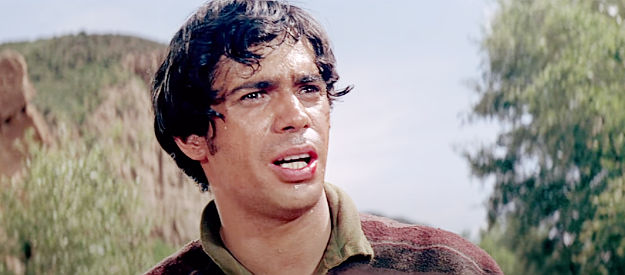 Reni Santoni as Maximiliano O'Leary, recruiting Chris and his friends to free a revolutionary leader in Guns of the Magnificent Seven (1969(