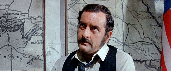 Riccardo Garrone as warden of the prison where the fortune in gold is stored in A Man Called Sledge (1970)