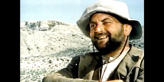 Robert Delaporte as Don Trent, one of the trio of hard-drinking, fun-loving peddlers in Johnny West (1965)