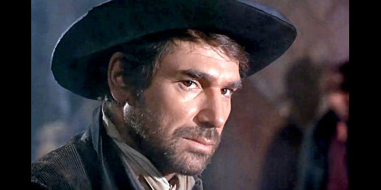 Robert Hossein as Manuel, Maria's reluctant tool of vengeance in Cemetery Without Crosses (1969)