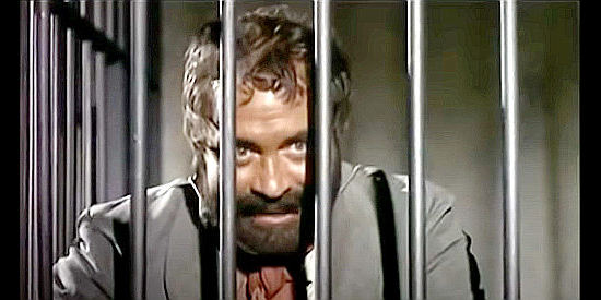 Roberto Camardiel as Jack Three Fingers Garcia. meeting Joaquin Murieta while awaiting a jailbreak in Murieta (1965)