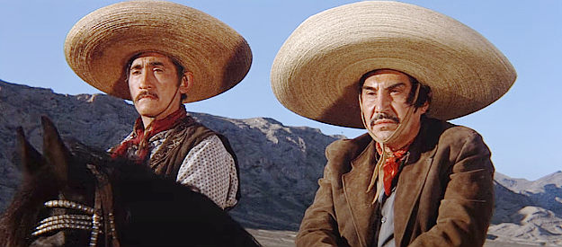 Rodolfo Acosta as Lopez and Emilio Fernandez as Lorca, preparing for another attack on the village they used to control in Return of the Seven (1966)