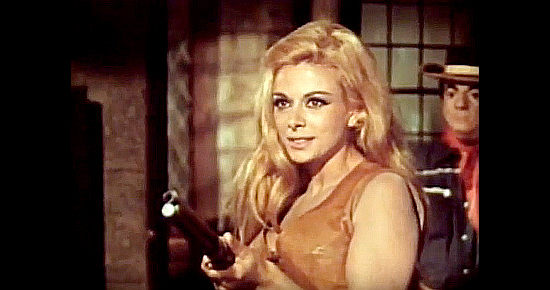 Sandra Milo as Gwenda Swaggel in a shooting mood with Bear Bullock in her sights in The Bang Bang Kid (1967)