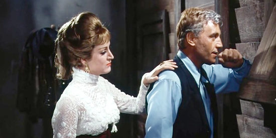 Millie with the sheriff (Guido Maculani as Harris Cooper), worried about coming trouble in The Last Gun (1964)