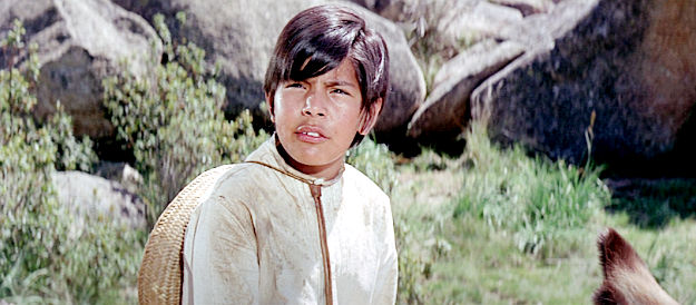 Tony Davis as Emiliano Zapata, a Mexican lad whose dad is rounded up by Lobero in Guns of the Magnificent Seven (1969)