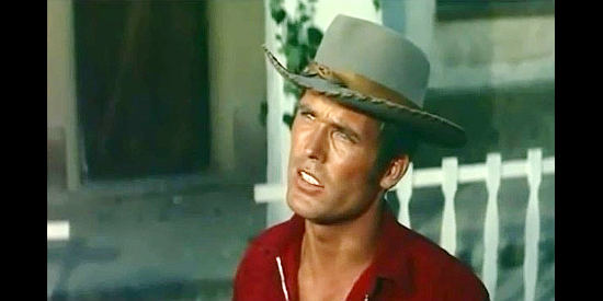 Ty Hardin as Johnny Walscott, confronting Sam Burnett about his daughter Gwen in Man from the Cursed Valley (1964)