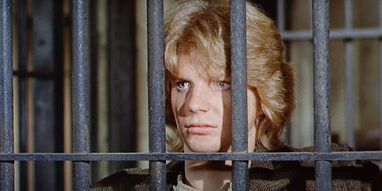 Darrell Larson as Shelly, a young man facing the prison and begging for a second chance in The Magnificent Seven Ride! (1972)