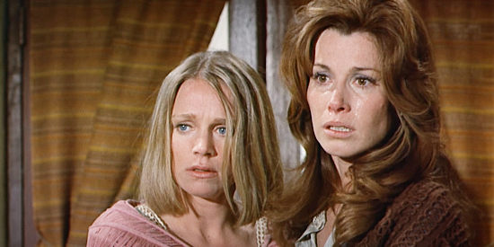 Melissa Murphy as Madge Buchanan and Stefanie Powers as Laurie Gunn, two of the villagers assaulted by the bandits in The Magnificent Seven Ride! (1972)