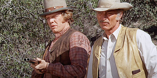 William Lucking as Walt Drummond with Lee Van Cleef as Chris Adams, keeping the rest of the seven in line in The Magnificent Seven Ride! (1972)