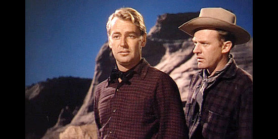 Alan Ladd as Capt Brett Sherwood, under the gun of Lane Waldron (Arthur Kennedy) in Red Mountain (1951)