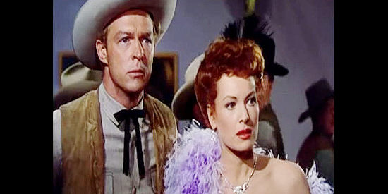 Alex Nicol as Sheriff Blaine and Maureen O'Hara as Kate Maxwell, reacting to the sound of gunfire in The Redhead from Wyoming (1953)
