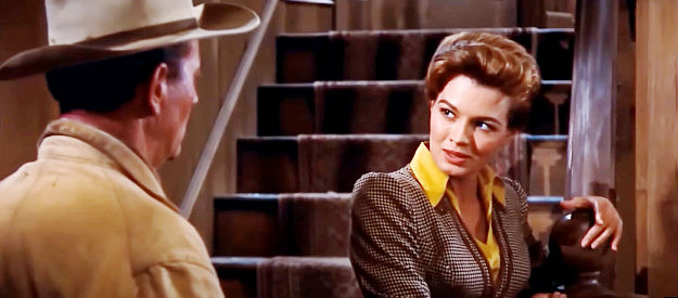 Angie Dickinson as Feathers, discussing gambling and life with Sheriff John T. Chance (John Wayne) in RIo Bravo (1959)