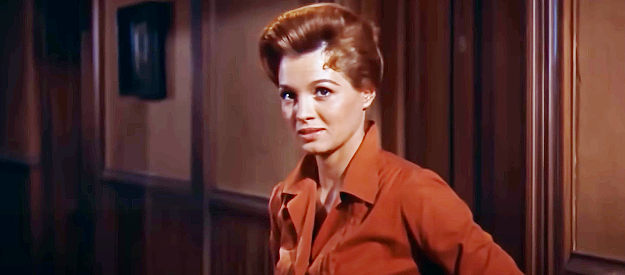 Angie Dickinson as Feathers, the tough lady gambler who winds up caring what happens to the town sheriff in Rio Bravo (1959)