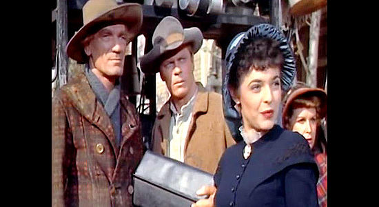 Ann Bancroft as Katy Bishop, coming to the defense of 'peddlers' Fred Deane (John Dierkes) and Frank Dwyer (Peter Graves) in The Raid (1953)