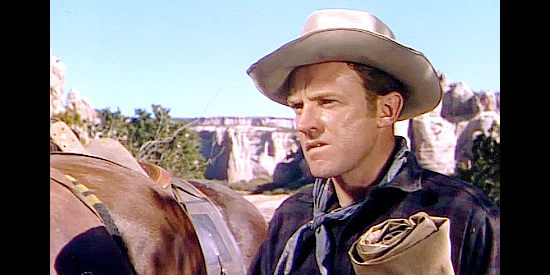 Arthur Kennedy as Lane Waldron, the man who struck it rich mining but is haunted by a murder charge in Red Mountain (1951)