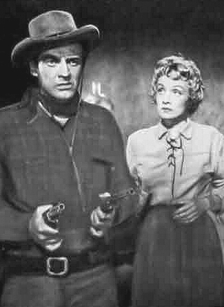 Arthur Kennedy as Vern Haskell and Marlene Dietrich as Altar Keane in Rancho Notorious (1952)