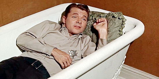 Audie Murphy as Joe Maybe, finding his bathtub the most convenient place to sleep in Ride a Crooked Trail (1958)