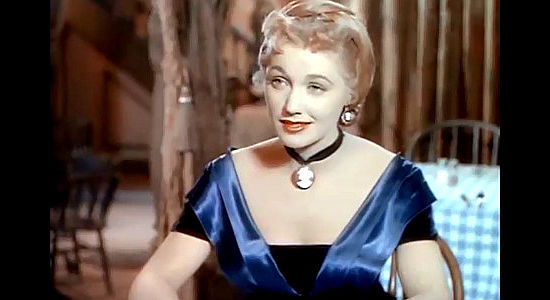 Audrey Long as Claire Conville, encouraging Kirby Frye to compete for her affections in Cavalry Scout (1951)