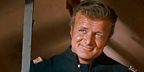 Brian Keith as Capt. Clark, commander of the expedition to build a new fort in Run of the Arrow (1957)