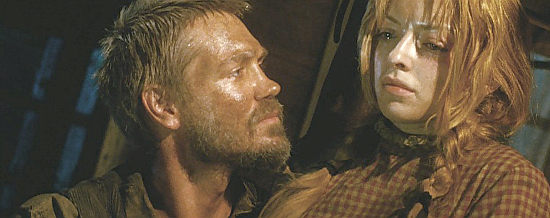 Chad Michael Murray as Henry decides Florence (Francesca Eastwood) should warm his lap in Outlaws and Angels (2016)