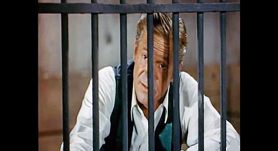 Dan Duryea as Jim Shanessy, the man behind the trouble with the railroad project in Rails Into Laramie (1954)