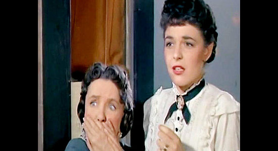 Helen Ford as Delphine Coates and Anne Bancroft as Katy Bishop, reacting to seeing a soldier shot in The Raid (1954)